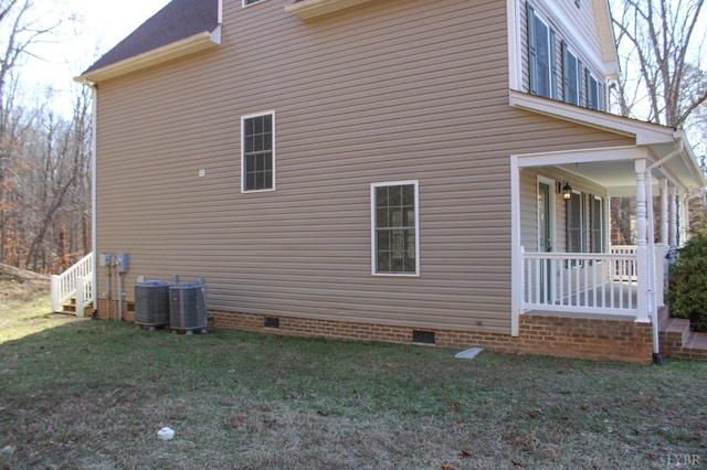 872 Two Bid Rd, Evington, VA 24550 - view of side of property featuring a porch, crawl space, central AC unit, and a lawn