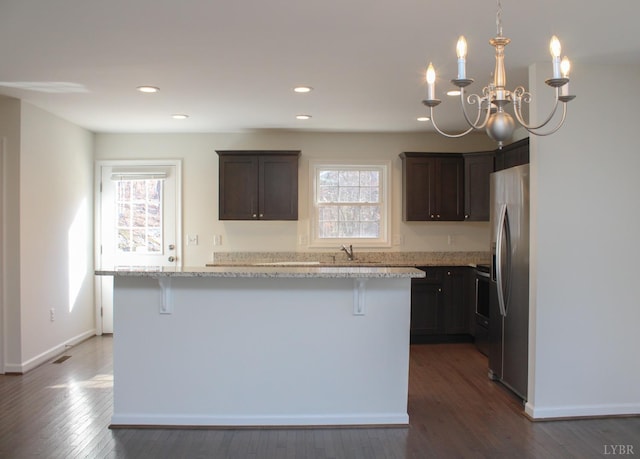 872 Two Bid Rd, Evington, VA 24550 - kitchen featuring dark wood-style floors, dark brown cabinets, stainless steel refrigerator with ice dispenser, and a healthy amount of sunlight