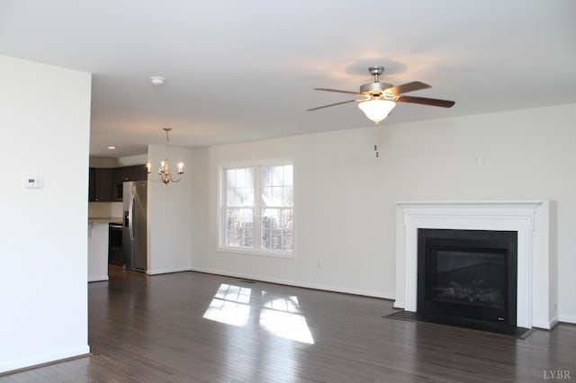 872 Two Bid Rd, Evington, VA 24550 - unfurnished living room with baseboards, a fireplace with flush hearth, ceiling fan with notable chandelier, and dark wood finished floors