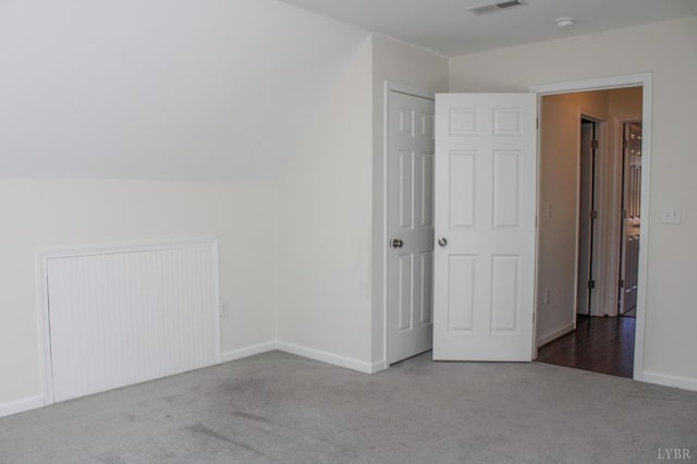 872 Two Bid Rd, Evington, VA 24550 - unfurnished bedroom featuring baseboards, carpet floors, lofted ceiling, and visible vents