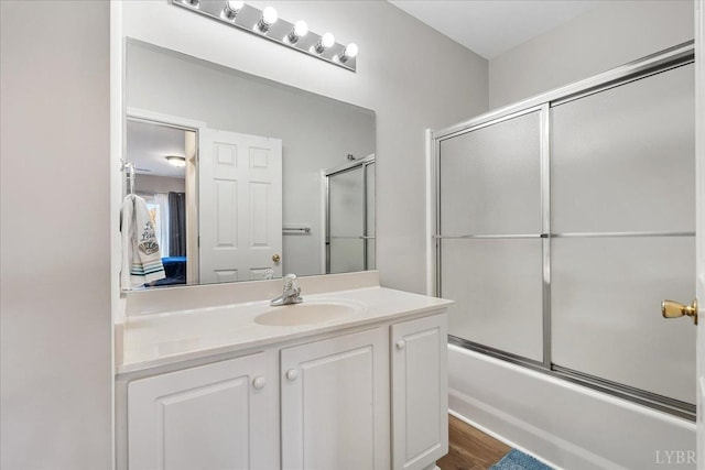 1055 Mariners Way, Huddleston, VA 24104 - bathroom with vanity, enclosed tub / shower combo, and wood finished floors
