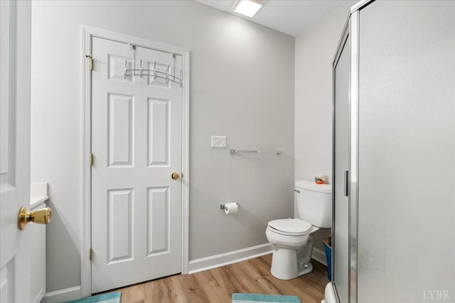 1055 Mariners Way, Huddleston, VA 24104 - full bathroom with wood finished floors, toilet, a shower stall, and baseboards