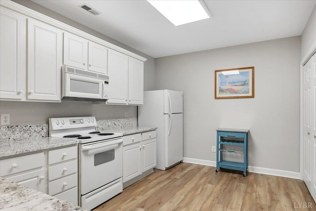 1055 Mariners Way, Huddleston, VA 24104 - kitchen featuring white appliances, baseboards, white cabinetry, light wood-type flooring, and light stone counters