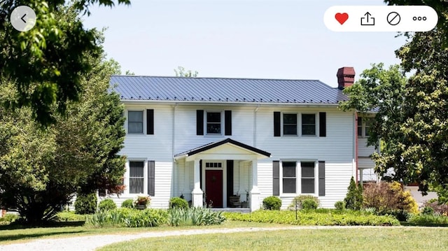 1501 Saxkey, Drakes Branch, VA 23937 - colonial inspired home with a chimney, metal roof, and a front yard