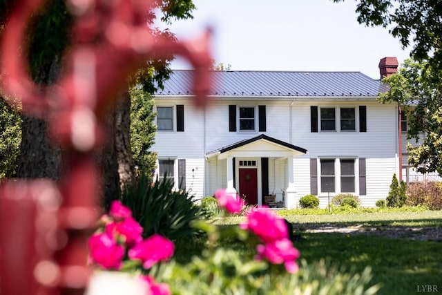 1501 Saxkey, Drakes Branch, VA 23937 - view of front facade with a chimney, metal roof, and a front yard