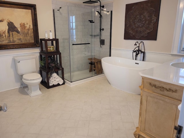 1501 Saxkey, Drakes Branch, VA 23937 - bathroom with a stall shower, a soaking tub, a wainscoted wall, toilet, and vanity