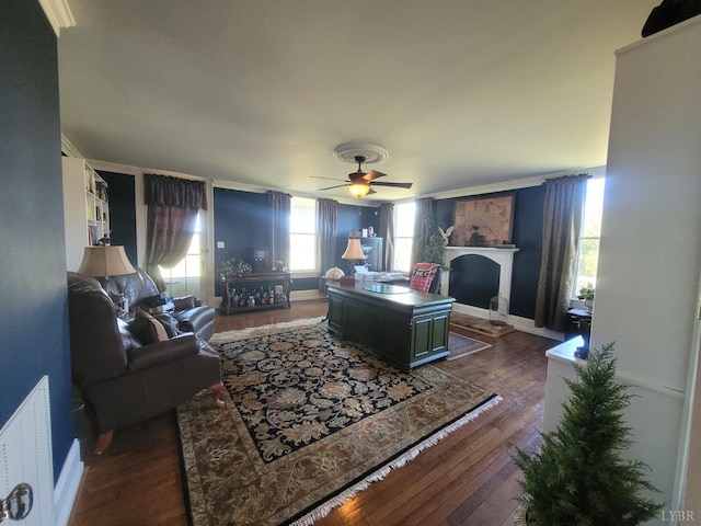 1501 Saxkey, Drakes Branch, VA 23937 - living area featuring dark wood-style flooring, a fireplace, and ceiling fan