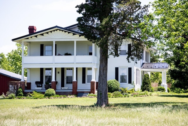 1501 Saxkey, Drakes Branch, VA 23937 - neoclassical / greek revival house featuring covered porch, a chimney, a balcony, and a front lawn
