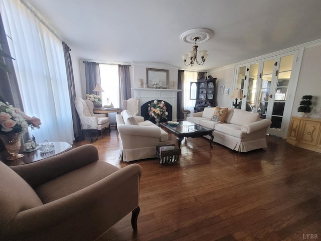 1501 Saxkey, Drakes Branch, VA 23937 - living area with a chandelier, wood finished floors, crown molding, and a fireplace