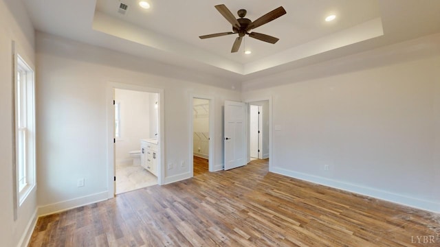 87 Greenhouse Rd, Rustburg, VA 24588 - unfurnished bedroom featuring a raised ceiling, recessed lighting, baseboards, wood finished floors, and visible vents
