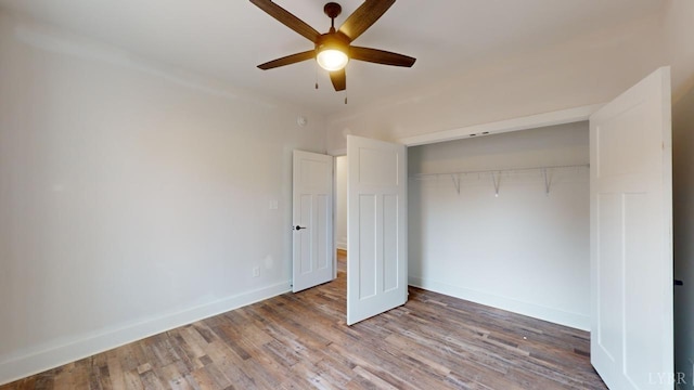 87 Greenhouse Rd, Rustburg, VA 24588 - unfurnished bedroom with baseboards, a ceiling fan, a closet, and wood finished floors