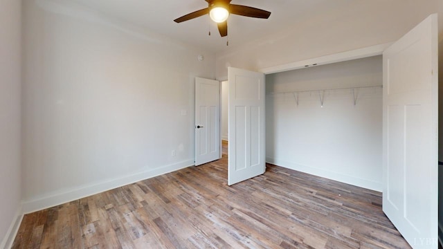 87 Greenhouse Rd, Rustburg, VA 24588 - unfurnished bedroom with baseboards, a ceiling fan, a closet, and wood finished floors