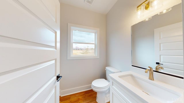 193 Allure Dr, Rustburg, VA 24588 - half bath featuring toilet, wood finished floors, vanity, visible vents, and baseboards