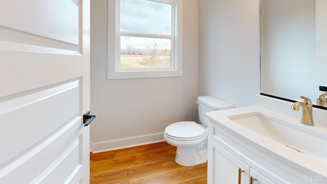 193 Allure Dr, Rustburg, VA 24588 - bathroom with baseboards, vanity, toilet, and wood finished floors