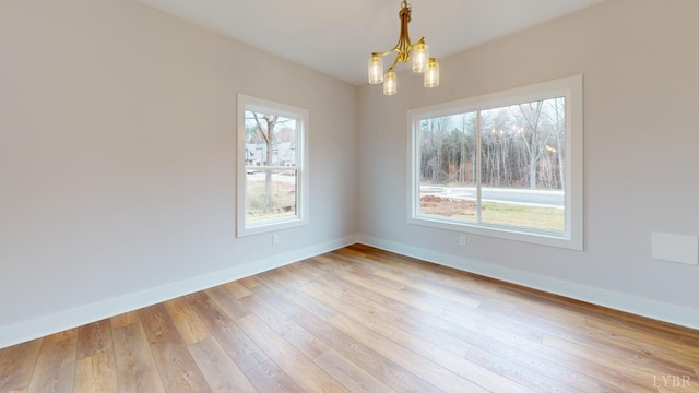 193 Allure Dr, Rustburg, VA 24588 - empty room with a notable chandelier, light wood-type flooring, and baseboards