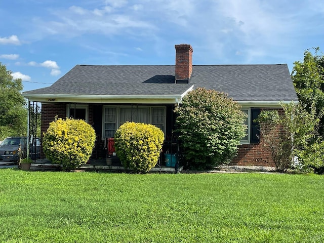 2685 Dearing Ford Rd, Altavista, VA 24517 - view of home's exterior featuring a chimney, a yard, brick siding, and a shingled roof