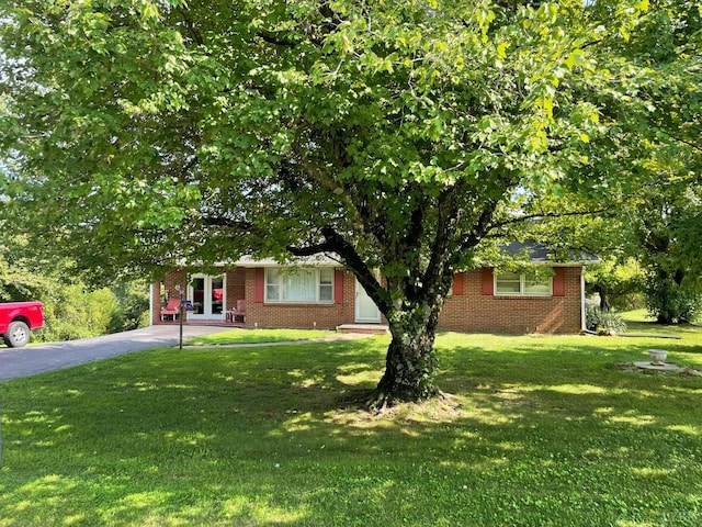 2685 Dearing Ford Rd, Altavista, VA 24517 - obstructed view of property featuring a front yard, brick siding, and driveway