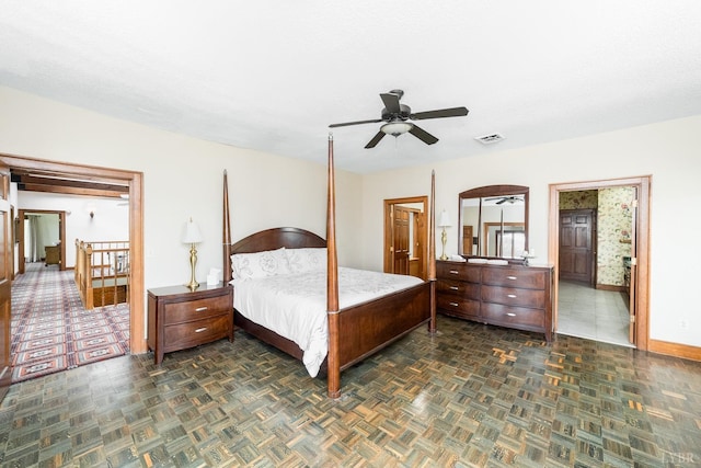bedroom with baseboards, ceiling fan, and visible vents