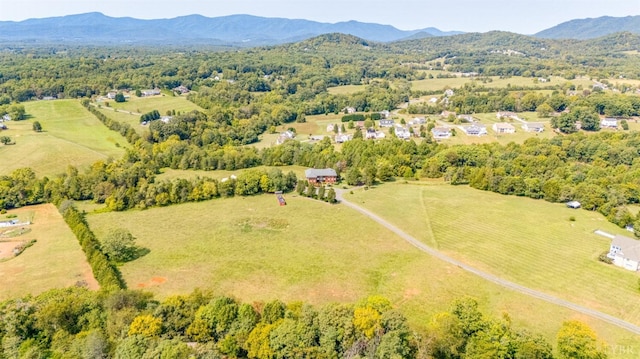 drone / aerial view with a mountain view and a rural view