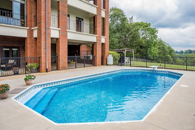view of pool with a pergola, fence, and a fenced in pool