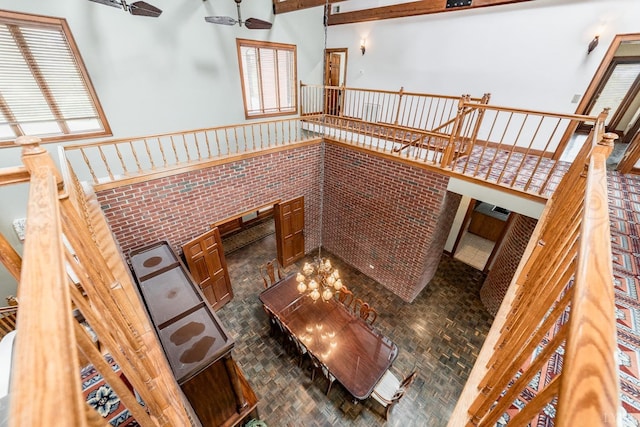 stairs featuring a towering ceiling