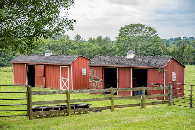 view of stable with a forest view