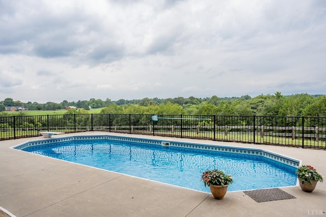 view of swimming pool with fence and a fenced in pool