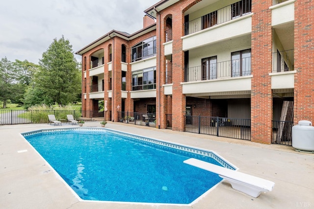 view of swimming pool with fence and a fenced in pool