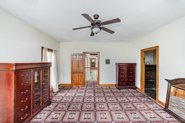 unfurnished bedroom with baseboards and a textured ceiling