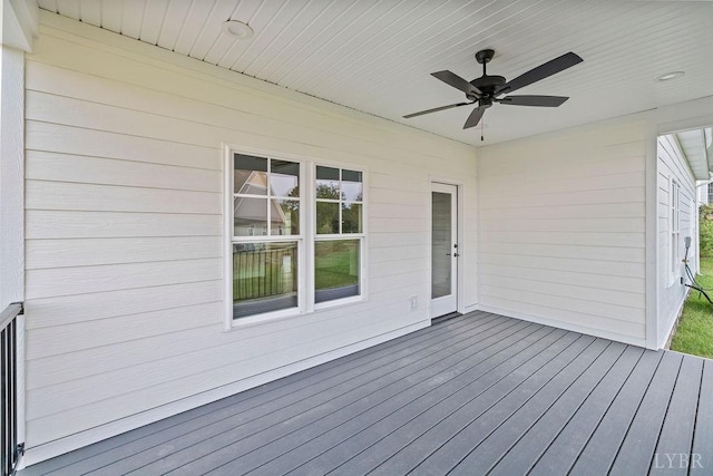 wooden deck featuring ceiling fan
