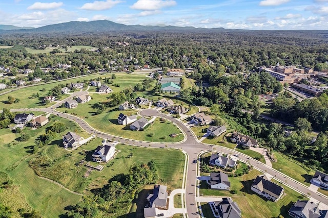 aerial view with a mountain view, a forest view, and a residential view
