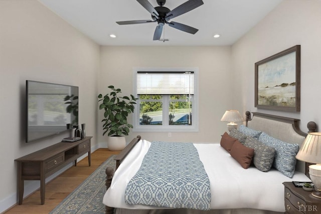 bedroom featuring ceiling fan, recessed lighting, baseboards, and wood finished floors