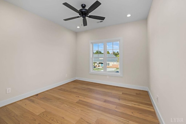 spare room with recessed lighting, baseboards, visible vents, and wood finished floors