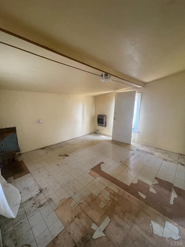 500 Amherst St, Lynchburg, VA 24504 - unfurnished living room with tile patterned floors, a wood stove, and heating unit