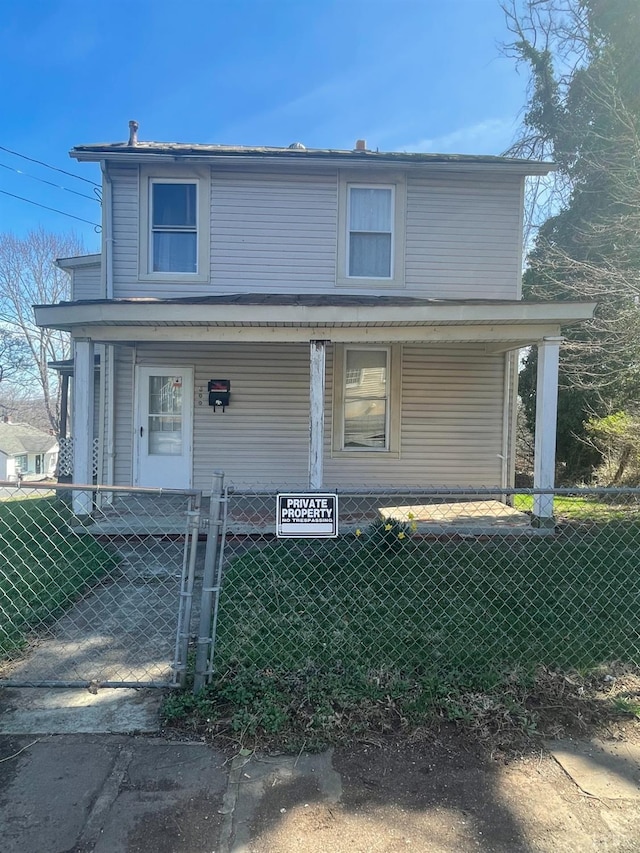 500 Amherst St, Lynchburg, VA 24504 - view of front facade featuring a front lawn, a gate, covered porch, and a fenced front yard