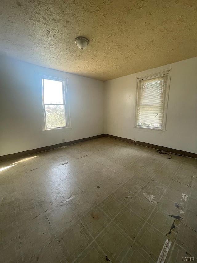 500 Amherst St, Lynchburg, VA 24504 - spare room with tile patterned floors, baseboards, and a textured ceiling