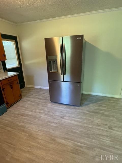 305 Eldon Rd, Appomattox, VA 24522 - kitchen with crown molding, baseboards, stainless steel fridge with ice dispenser, light wood-type flooring, and a textured ceiling