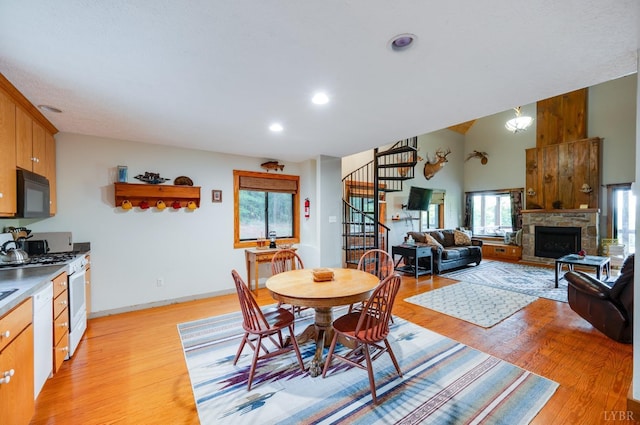 1343 Wares Gap Rd, Monroe, VA 24574 - dining space with stairs, recessed lighting, baseboards, light wood-style floors, and a fireplace