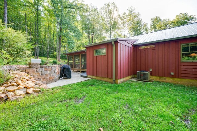 1343 Wares Gap Rd, Monroe, VA 24574 - exterior space featuring a lawn, a sunroom, central air condition unit, and board and batten siding