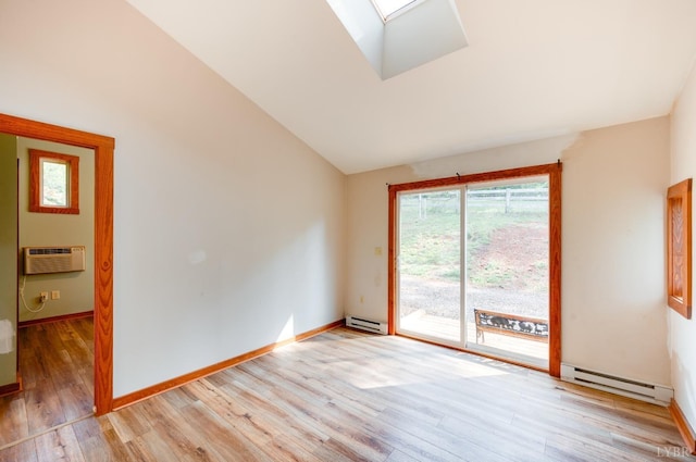 1343 Wares Gap Rd, Monroe, VA 24574 - unfurnished room with a wall unit AC, vaulted ceiling with skylight, light wood finished floors, and baseboard heating