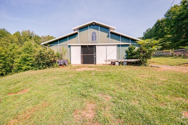 1343 Wares Gap Rd, Monroe, VA 24574 - back of property with a lawn, fence, and an outdoor structure