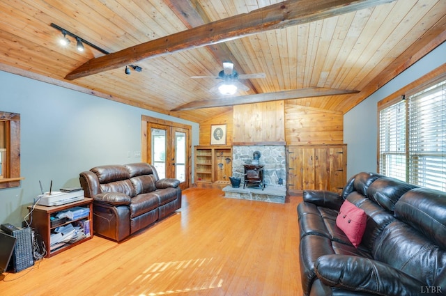 1343 Wares Gap Rd, Monroe, VA 24574 - living room featuring wooden ceiling, french doors, lofted ceiling with beams, wood finished floors, and a wood stove