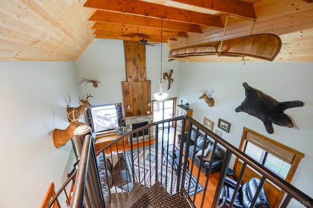 1343 Wares Gap Rd, Monroe, VA 24574 - staircase featuring beamed ceiling, a wealth of natural light, wood finished floors, and wooden ceiling