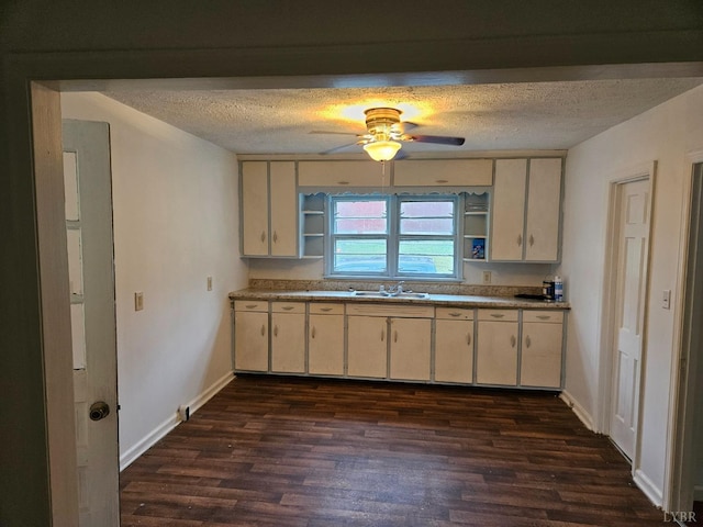 kitchen featuring ceiling fan, a textured ceiling, open shelves, and dark wood-type flooring