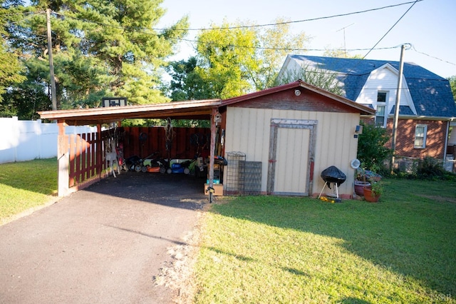 811 Broad St, Altavista, VA 24517 - view of outdoor structure with a lawn and a carport