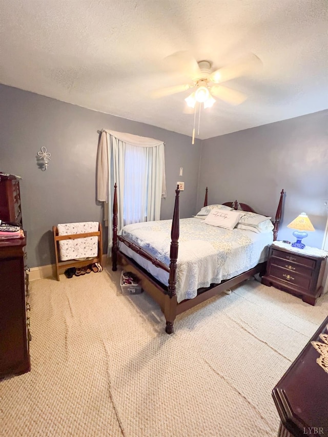 811 Broad St, Altavista, VA 24517 - carpeted bedroom with a textured ceiling and ceiling fan