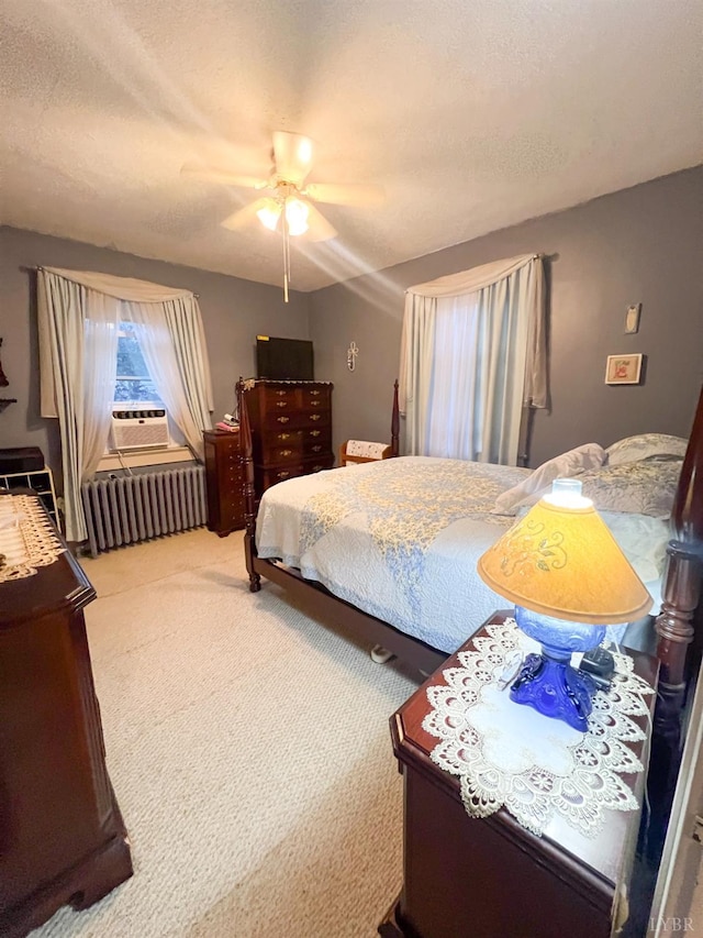 811 Broad St, Altavista, VA 24517 - bedroom with a textured ceiling, cooling unit, radiator, carpet, and ceiling fan