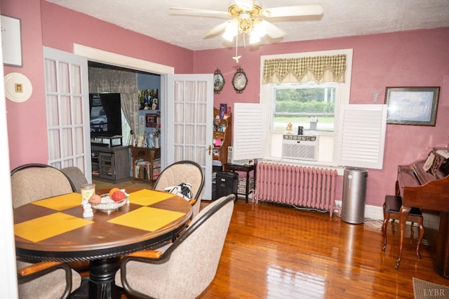 811 Broad St, Altavista, VA 24517 - dining space featuring radiator, ceiling fan, wood-type flooring, and a textured ceiling