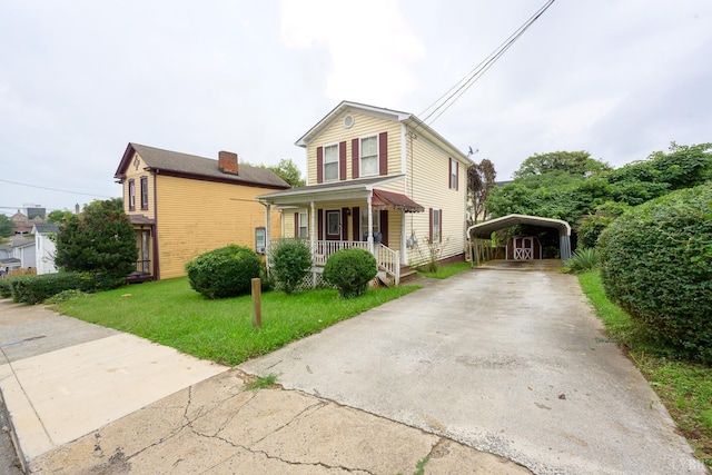 906 8th St, Lynchburg, VA 24504 - traditional-style home featuring covered porch, a detached carport, a front yard, and driveway