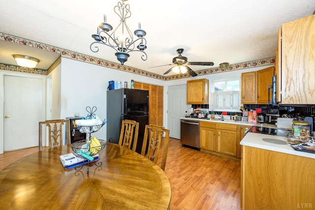 906 8th St, Lynchburg, VA 24504 - kitchen with black appliances, light countertops, ceiling fan, and brown cabinets